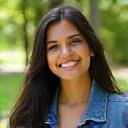 Customer Priya K. wearing her upcycled denim jacket in a park.