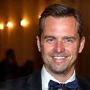 Customer Michael B. smiling at a formal event.